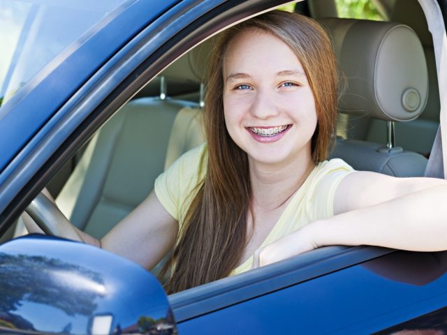 Teenage girl learning to drive