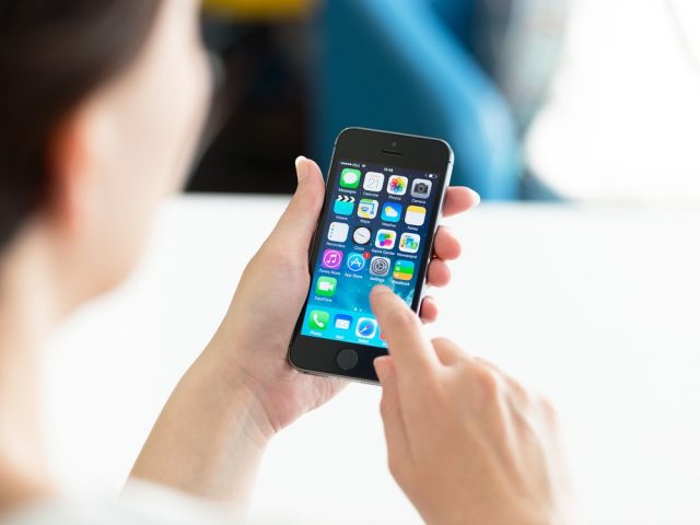 Woman Using Apple Iphone 5S