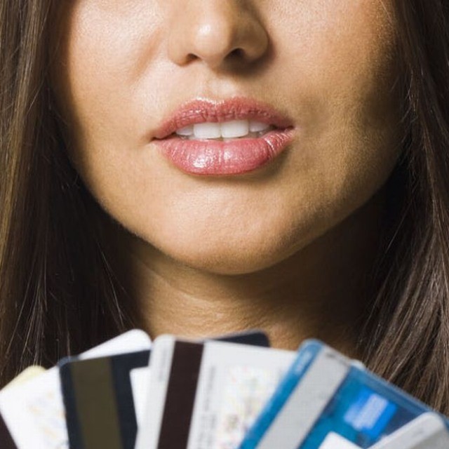 5. Woman holding several credit cards
