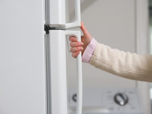 9 woman-opening-refrigerator-door (copy)
