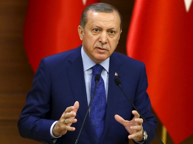 Turkish President Tayyip Erdogan makes a speech during his meeting with mukhtars at the Presidential Palace in Ankara
