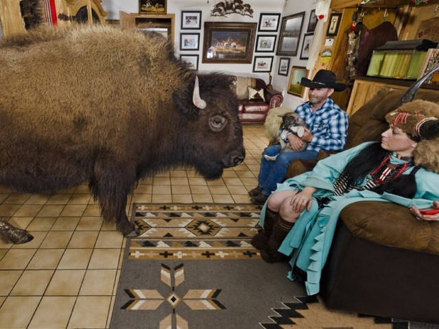 15 RC and Sherron Bridges with their pet buffalo inside their house in Quinlan, Texas