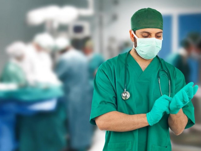 91 doctor-puts-on-surgical-gloves (copy 1)