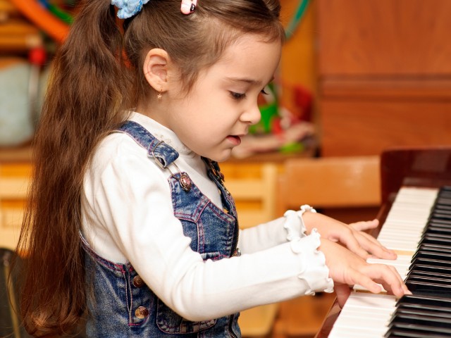 Girl plays piano