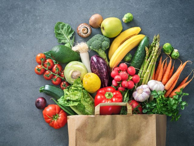 Shopping bag full of fresh vegetables and fruits